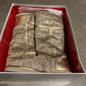 Never worn Size 7 Coach gold and silver winter boots.